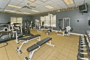 a gym with several treadmills and exercise bikes at Spacious with golf and wildlife views 1233-4 in Sampson