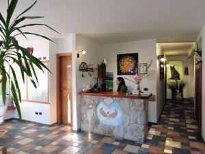 a restaurant with a stone counter in a room at Casa Hotel Civitella in Civitella Alfedena