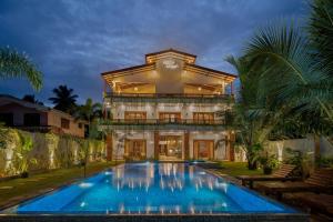 a house with a swimming pool in front of it at Asiri Villa in Dickwella