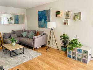 a living room with a couch and a table at Maison village provençal in Éguilles
