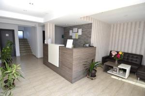 a lobby with a reception desk in a building at Vila Bliss in Costinesti