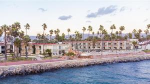 a row of buildings next to a body of water at Estero Beach Hotel & Resort in Ensenada