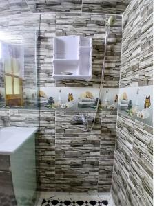 a bathroom with a sink and a shower at villa ourika complette in Sbiti