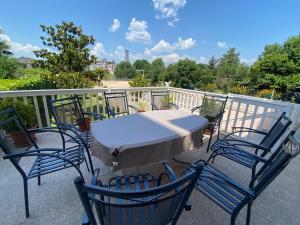 a table and four chairs on a balcony at Guest House Regina Mundi in Međugorje