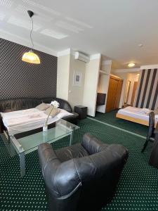 Postel nebo postele na pokoji v ubytování Hotel Vacek Pod Věží