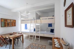 a room with a dining table and a bunk bed at Pension Katzensprung in Passau