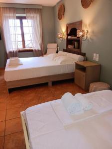 Postel nebo postele na pokoji v ubytování Galini Hotel Agios Ioannis Pelion