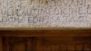a stone wall with a sign on top of a door at Maison de maître en pierre de 1831 avec vue sur la mer à Porticcio in Porticcio +36 photos