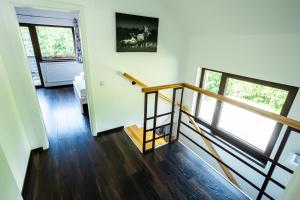 a staircase in a house with a stair case at CABANA BERNER stațiunea Mogoșa in Baia-Sprie