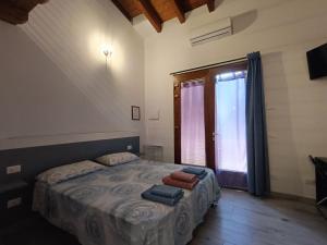 Postel nebo postele na pokoji v ubytování Agriturismo Cascina Lert + 37 fotografií