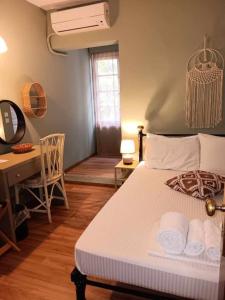Postel nebo postele na pokoji v ubytování Galini Hotel Agios Ioannis Pelion + 16 fotografií