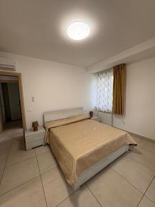 Postel nebo postele na pokoji v ubytování Case del Mare - Corallo, Perla, Acquamarina