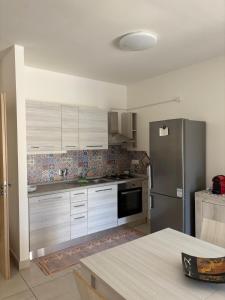 Kuchyň nebo kuchyňský kout v ubytování Case del Mare - Corallo, Perla, Acquamarina