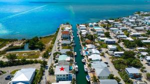 an aerial view of a harbor with a marina at Tipsy Turtle - Waterfront Pool Home, Direct Atlantic Access! in Marathon