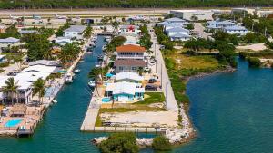 an aerial view of a resort on the water at Tipsy Turtle - Waterfront Pool Home, Direct Atlantic Access! in Marathon
