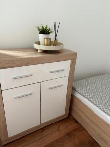 Postel nebo postele na pokoji v ubytování Silver Gull Apartman