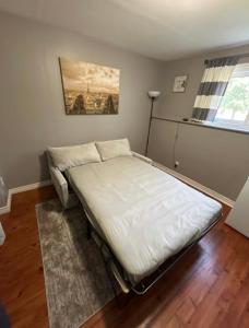 a bedroom with a bed in a room at Cozy & Private Full Floor at Minnow Lake in Sudbury