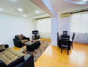 a living room with a couch and a table at Квартира in Aghk'ilisa