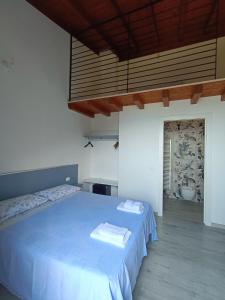 Postel nebo postele na pokoji v ubytování Agriturismo Cascina Lert