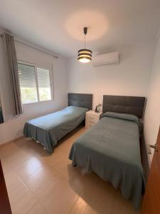Ένα ή περισσότερα κρεβάτια σε δωμάτιο στο Chalet Puente del Miso +5 φωτογραφίες