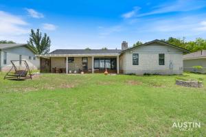 a home with a yard with a house at Backyard w Deck, Yoga Space 3BR 2BA Home Parking Near Domain by Austin Vacay in Austin