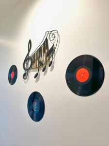 a wall with two cds and a cd holder at HOUSE OF ROCK - DOWNTOWN, RUPP ARENA, KEENELAND, HORSE PARK in Lexington