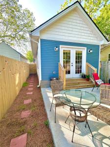 a patio with chairs and a glass table in front of a house at HOUSE OF ROCK - DOWNTOWN, RUPP ARENA, KEENELAND, HORSE PARK in Lexington +71 photos