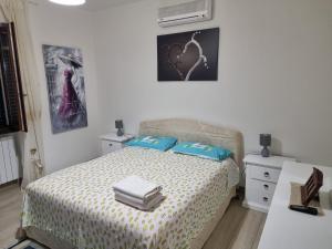 Postel nebo postele na pokoji v ubytování Rosy Vacation Home