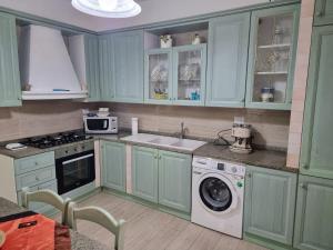 Kuchyň nebo kuchyňský kout v ubytování Rosy Vacation Home