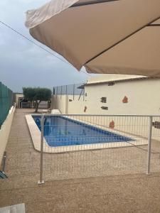 a swimming pool in front of a building at La Casica Vieja in Albujón +16 photos