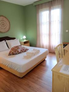 Postel nebo postele na pokoji v ubytování Galini Hotel Agios Ioannis Pelion