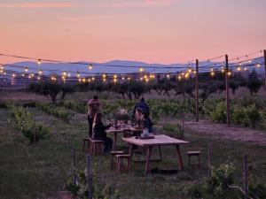a group of people sitting at a table in a field at Cortijo de la Seda in Granada