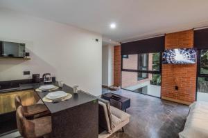 Η κουζίνα ή μικρή κουζίνα στο LOFT en Americana Torre con alberca, Gym, Pet fr