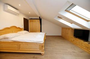 Postel nebo postele na pokoji v ubytování Hotel & wellness Hejtmanka
