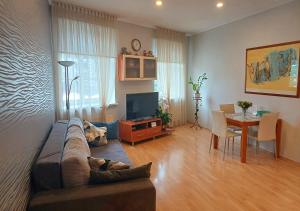 a living room with a couch and a table at Lux-Apartment in Medieval Part of Old Riga in Riga