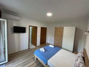 Postel nebo postele na pokoji v ubytování Markovi Apartments
