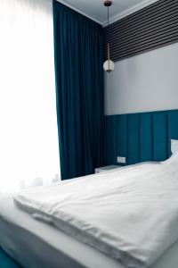 Postel nebo postele na pokoji v ubytování Ora Hotel