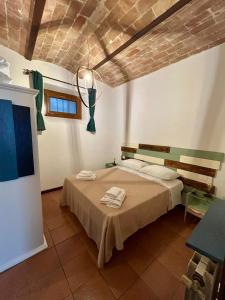 En eller flere senge i et værelse på Casetta al Corso