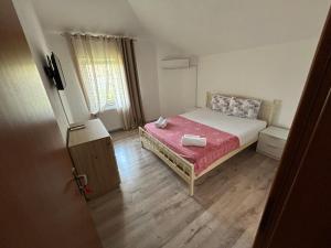 Postel nebo postele na pokoji v ubytování Markovi Apartments