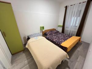 Postel nebo postele na pokoji v ubytování Happy Hostel