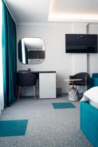 TV a/nebo společenská místnost v ubytování Ora Hotel