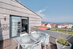 Balkón nebo terasa v ubytování Faro de Corrubedo by Serendipia Turismo