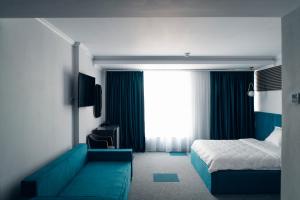 Postel nebo postele na pokoji v ubytování Ora Hotel