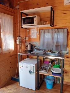 Kuchyň nebo kuchyňský kout v ubytování D'Charrúas Cabañas Chajarí
