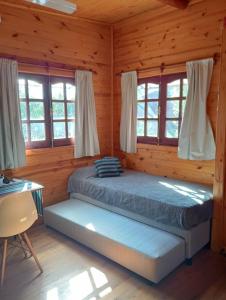 Postel nebo postele na pokoji v ubytování D'Charrúas Cabañas Chajarí + 28 fotografií
