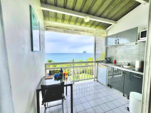 Mynd úr myndasafni af Ginestoo - appartement vue mer, piscine, mer à pied í Le Diamant