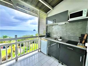 Mynd úr myndasafni af Ginestoo - appartement vue mer, piscine, mer à pied í Le Diamant