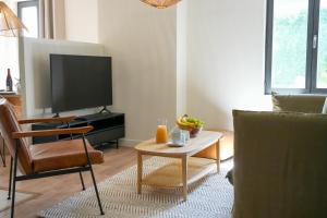 TV a/nebo společenská místnost v ubytování Le Clos de St Val 2