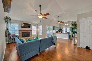 a living room with a couch and a ceiling fan at The Nestle 3-Bed 2-Bath Chapin - Near Lake Murray in Chapin