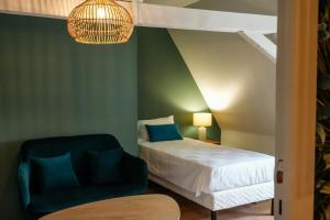 En eller flere senge i et værelse på Le Clos de St Val 6